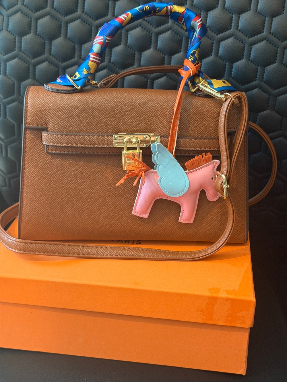Brown Leather Top-Handle Women’s Bag with Pink Winged Charm